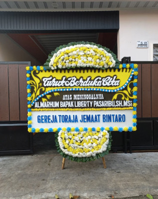 Papan Bunga Duka di Sujung